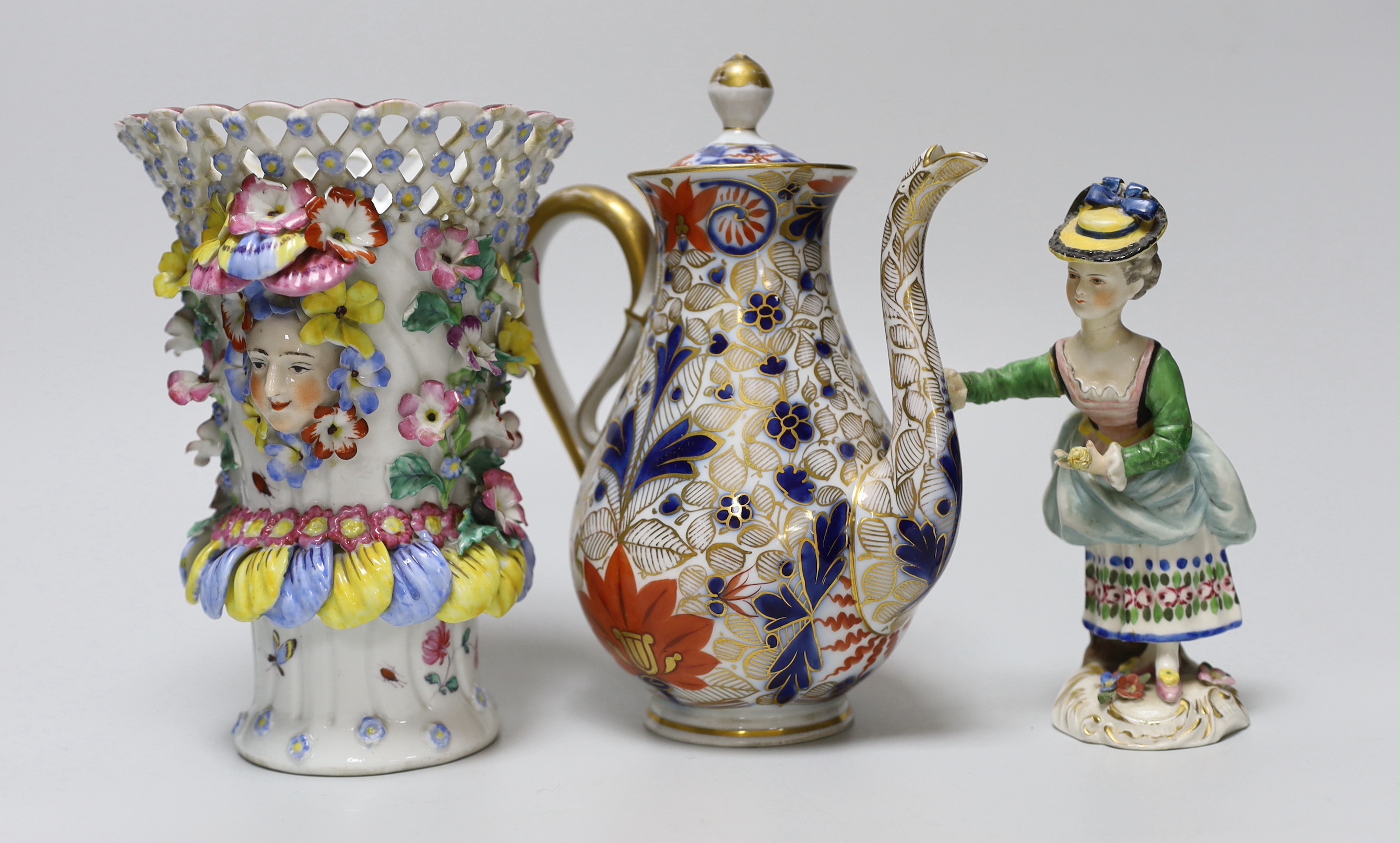 A 19th century German figure of a girl, 19cm, Vienna-type female figure, German figure of a boy and similar figure group, a continental coffee pot and an encrusted vase, the largest 18cm high